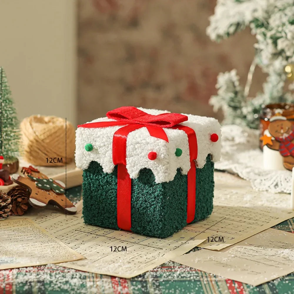 Boîte cadeau verte à nœud rouge