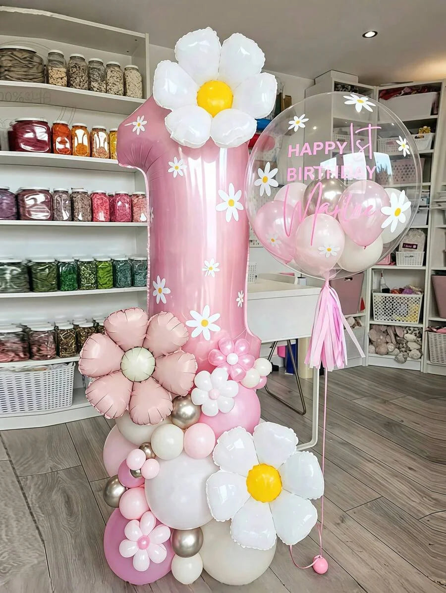 Exemple de décor anniversaire fleuri avec chiffre rose 1