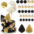 Kit de décorations de gâteau noir et or avec exemple de composition