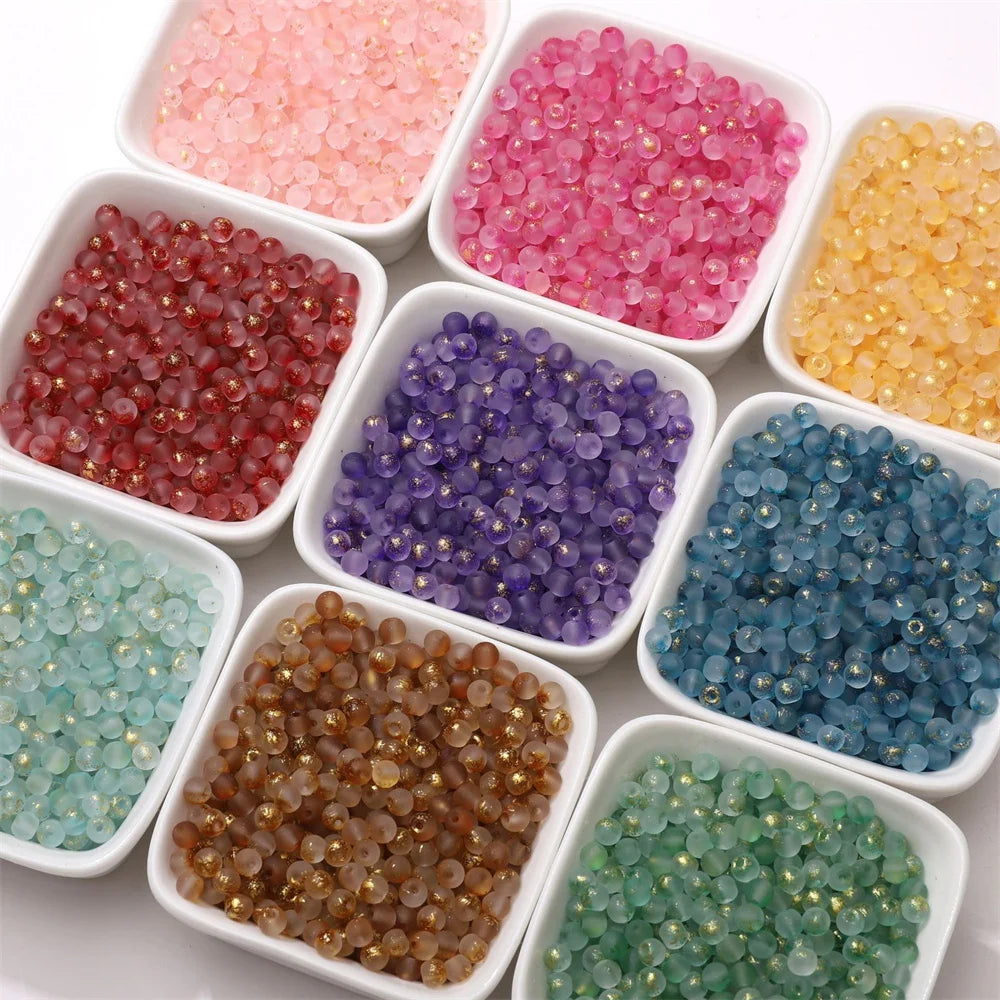 Exemples de couleurs de perles rondes en verre à éclats dorés