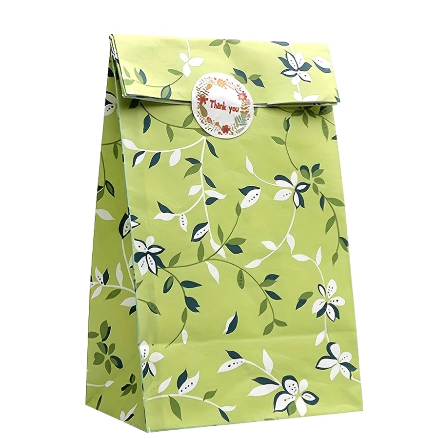 Sachet cadeau vert à motifs de feuilles et de fleurs